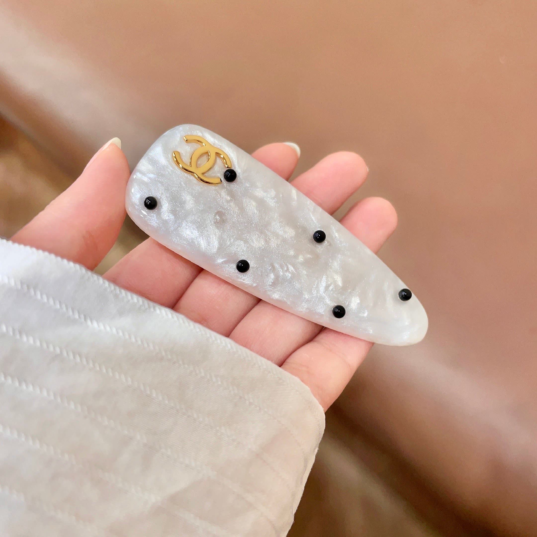 Chanel White Pearl Hair Clip with Gold CC Logo